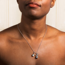 Load image into Gallery viewer, Close-up of the dice and mice pendant showing carved detail