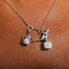 Load image into Gallery viewer, Dice and mice pendant shown from a side angle