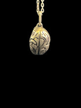 Load image into Gallery viewer, A silver pendant necklace featuring an intricately carved, brain sculptural charm, with a silver chain