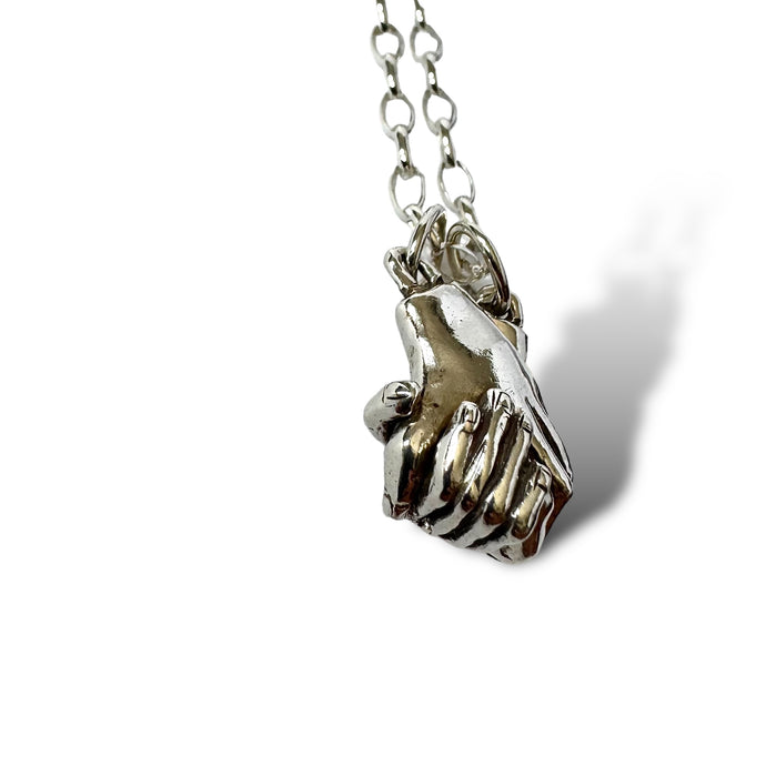 Holding hands pendant