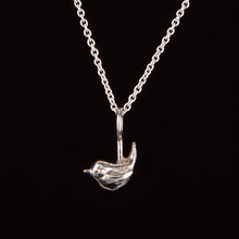 Load image into Gallery viewer, Close-up of the wren pendant showing hand-carved feather detail
