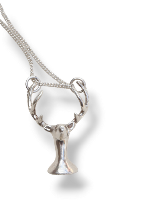 Deer with a tear pendant