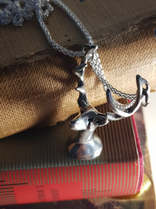 Deer with a tear pendant
