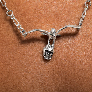 Skull and gull pendant