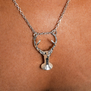 Deer with a tear pendant
